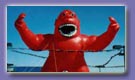 Gorilla advertising balloons - 30ft. Red Gorilla inflatables for sale or rent.